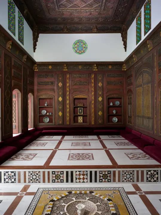 Panelled room with a patterned marble floor