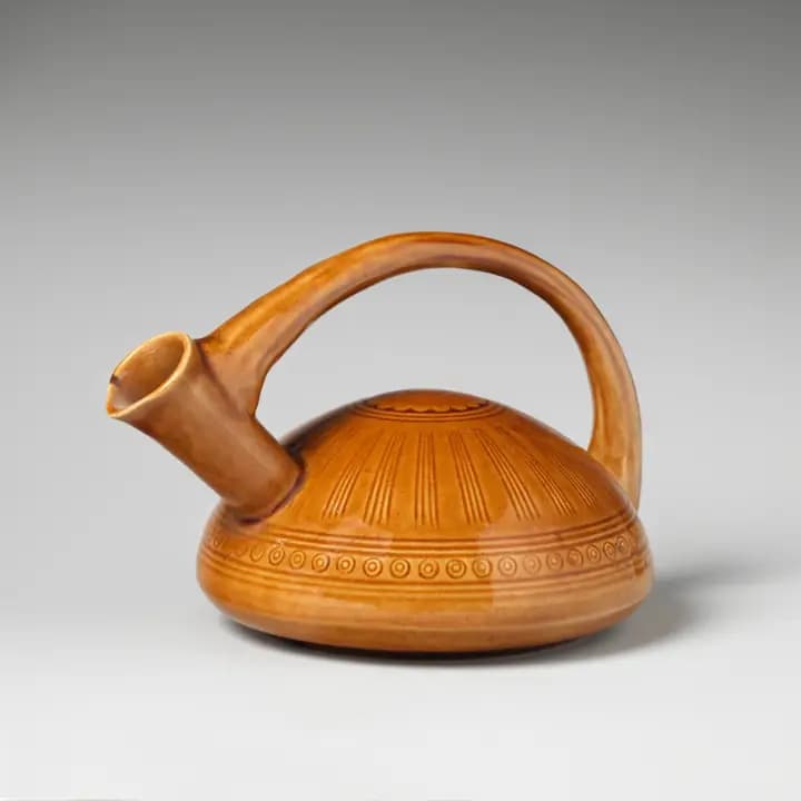Ochre pitcher with a hooked spout