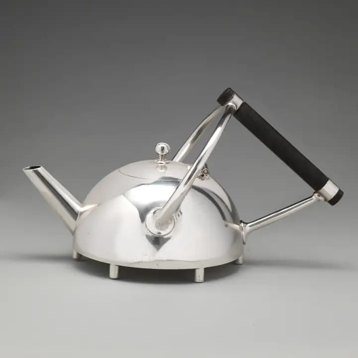 Silver teapot with an ebony handle