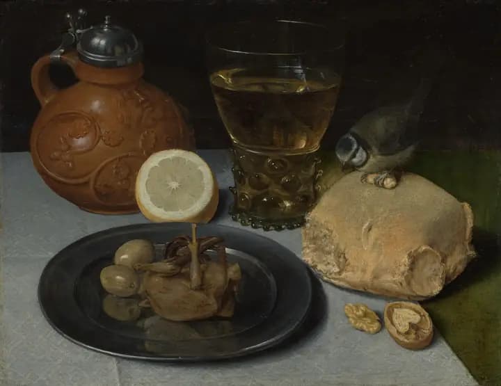 Lemon, wine and cheese on a dark table